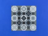 an image of a blue square with a black and white pattern on it