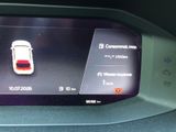 a picture of a car ' s dashboard with a digital display on it