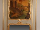 a picture of a mirror with a painting on it