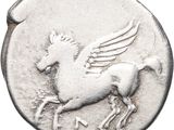 a close up of a silver coin with a horse on it