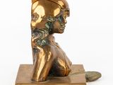 an image of a bronze statue of a woman with a hat on her head