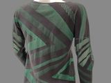 a mannequin mannequin wearing a green and black top