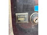 a close up of a machine with a sticker on it