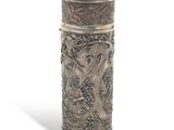 an image of a metal container with a dragon design on it