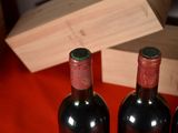 three bottles of wine sitting next to each other on a table