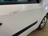 a small white car with a sticker on the side of it