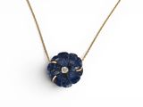 a blue flower pendant with a diamond on a gold chain