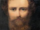 portrait of a bearded man with blue eyes and a beard