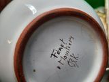 a person holding a coffee cup with writing on it