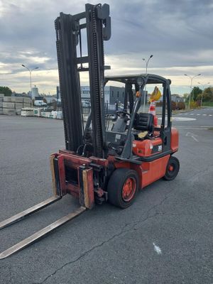 a forklift that is parked in a parking lot