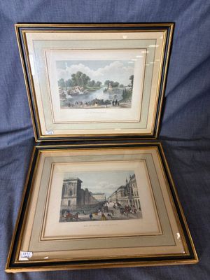 two framed prints of a city scene and a picture of a street