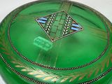 a green box with a design on it on a table