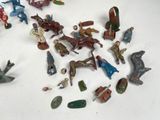 a lot of toy figurines that are on a table