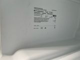 a close up of the inside of a white refrigerator