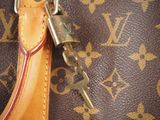a close up of a purse with a lock on it