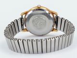 an image of a close up of a wrist watch on a white surface