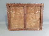 an old wooden box with a rope on top of it