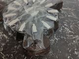 a chocolate cake that is sitting on a marble table
