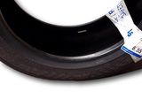 a tire with a tape on the side of it