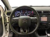a picture of the interior of a car with a steering wheel and dashboard