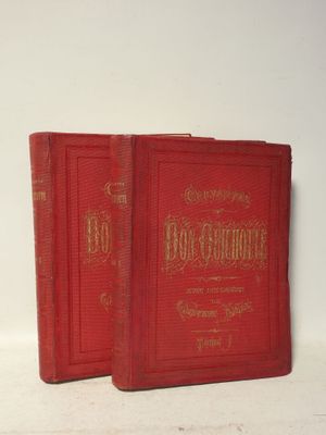 deux livres rouges posés l'un sur l'autre sur une surface blanche
