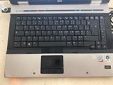a laptop computer sitting on top of a table