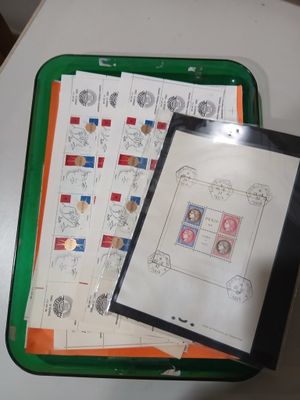 a picture of a green tray with stamps and a picture of a man