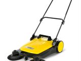 a yellow and black sweeper on a white background