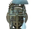 a clock that is sitting on a stand with a blue dome on top of it