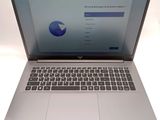 an open laptop computer sitting on top of a white table