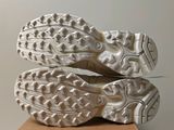 the soles of a pair of running shoes on top of a cardboard box