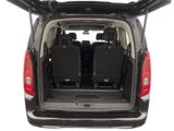 two seats in the back of a van with the door open
