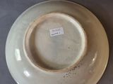 a plate with a tag on it sitting on a table