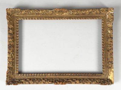 an ornate gold frame with a white background