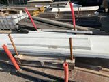 a pile of concrete blocks sitting on a pile of pallets