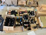 many bottles of wine in boxes on the floor