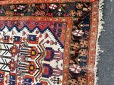 rug on the ground with a cat laying on top of it