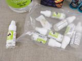 a bag of toothpaste, toothpaste, and toothpaste pastes on a table