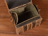 an old suitcase sitting on a wooden floor
