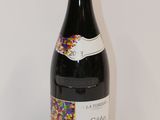 a bottle of wine with sprinkles on it