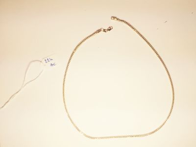 a necklace and a pair of scissors on a table