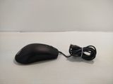 a computer mouse and a charger sitting on a table