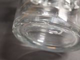 a close up of a glass jar with water inside of it