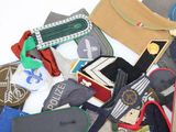 a pile of different types of clothing on a white surface
