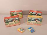 three tin lunch boxes with a horse and a dog on them