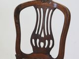 a wooden chair with a yellow upholstered seat