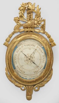 an antique clock with a gold frame and a clock face
