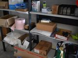 boxes and boxes are stacked on a shelf in a garage
