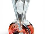 a glass perfume bottle with a red and white design on it