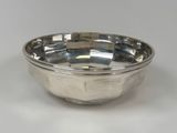 an image of a silver bowl on a white surface